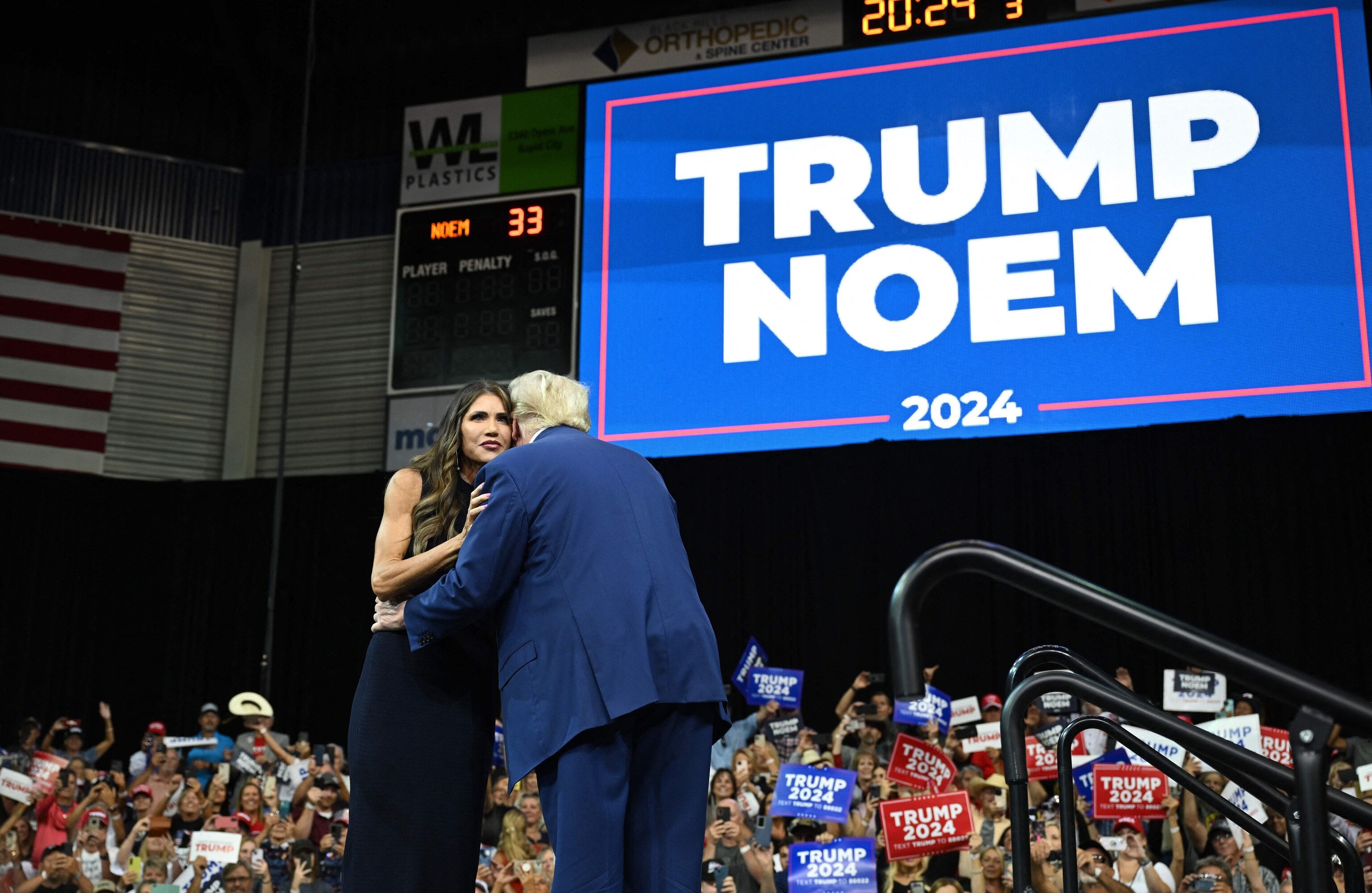 PHOTO: Former president and 2024 Republican Presidential hopeful Donald Trump and South Dakota Governor, Kristi Noem hug on stage during the South Dakota Republican Party's Monumental Leaders rally in Rapid City, S.D., Sept. 8, 2023.