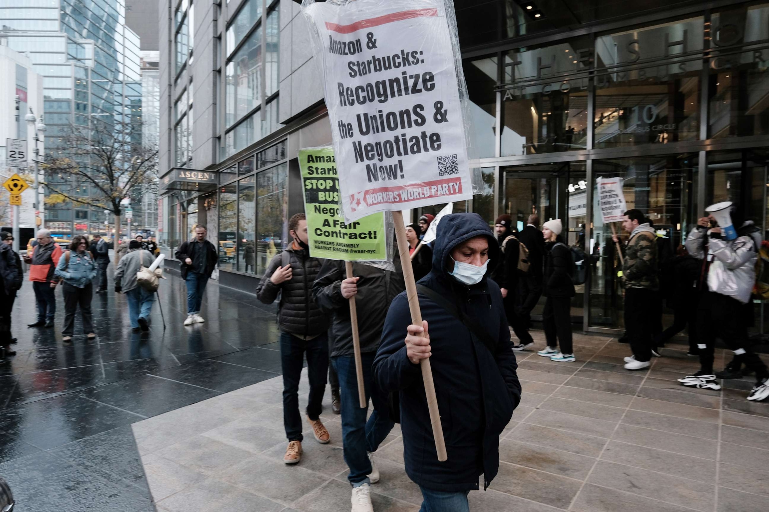 PHOTO: Members of the Amazon Labor Union and others protest outside of the New York Times DealBook Summit on Nov. 30, 2022 in New York City.