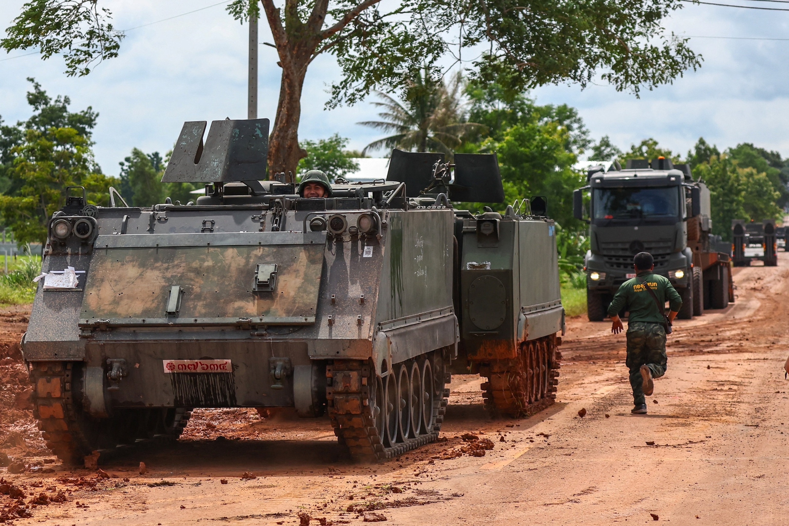 PHOTO: Armoured personnel carriers (APC) are seen on a road near Thailand-Cambodia's border in Sisaket province, the day after the leaders of Cambodia and Thailand agreed to a ceasefire on Monday, in Thailand, July 29, 2025. 