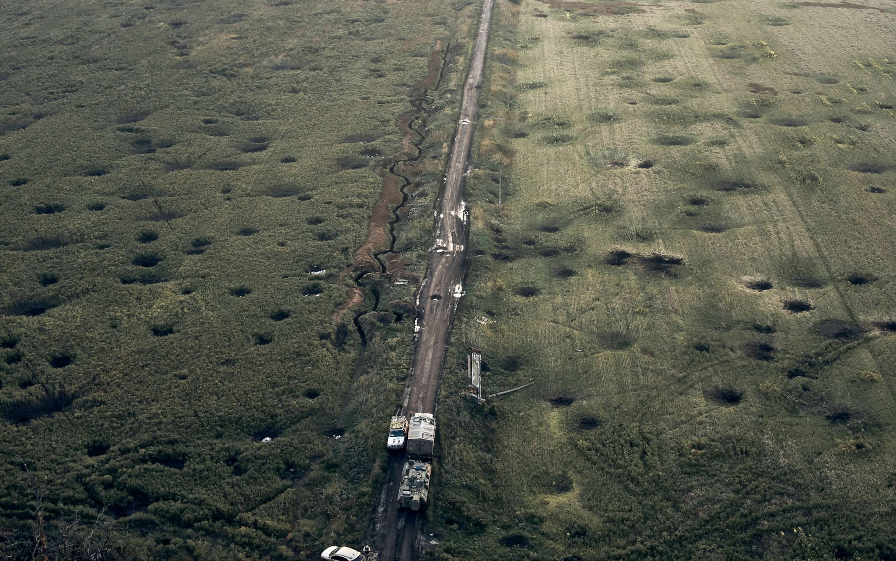 PHOTO: A field is covered with craters left by the shelling close to Izium, Kharkiv region, Ukraine, Sept. 13, 2022.