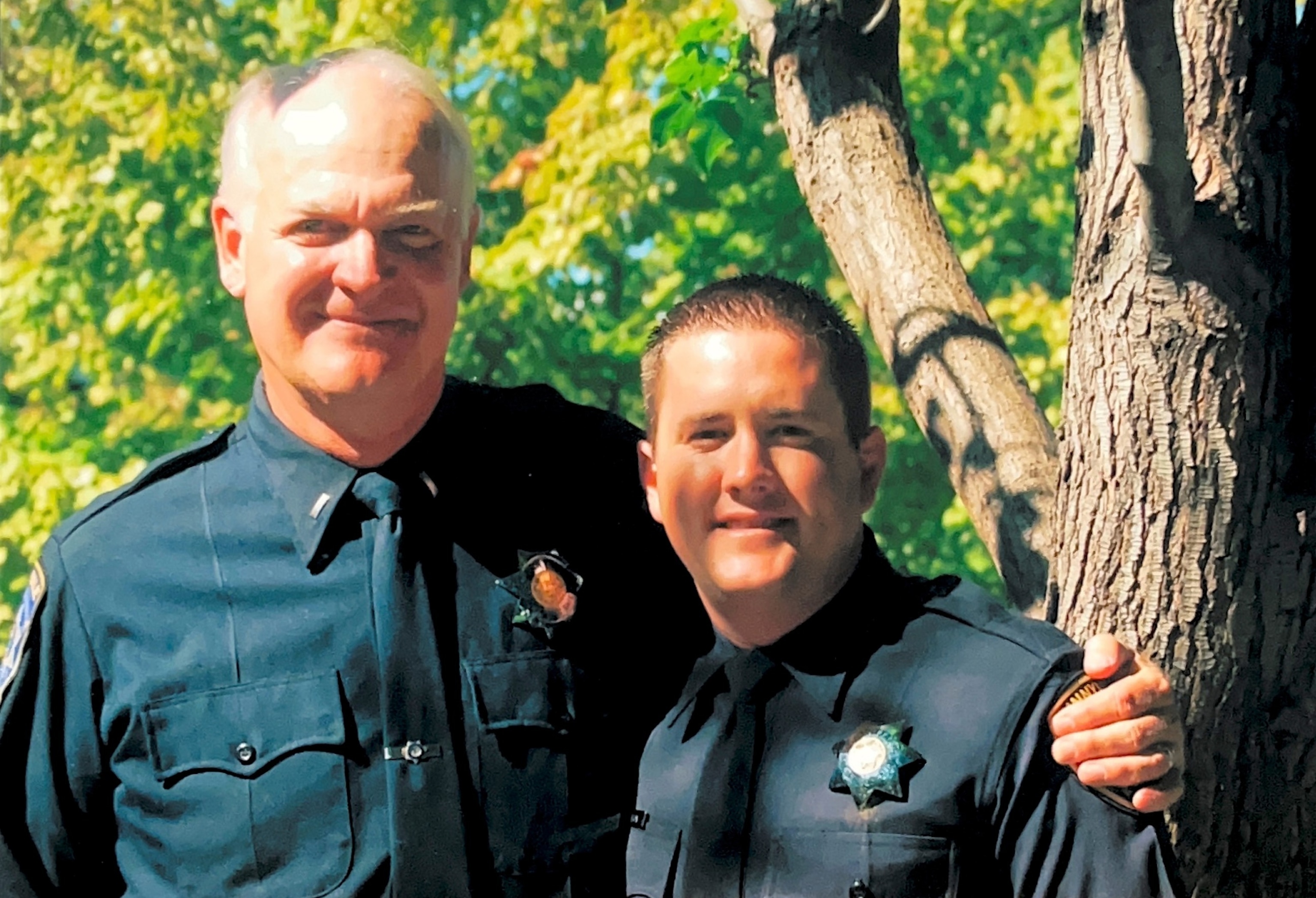 PHOTO: Detective Matt Hutchison (right) smiles with his stepfather who also served Sunnyvale as a police officer for over 30 years.
