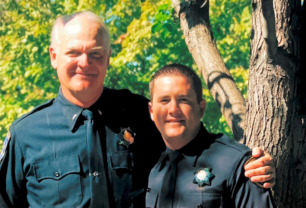 PHOTO: Detective Matt Hutchison (right) smiles with his stepfather who also served Sunnyvale as a police officer for over 30 years.