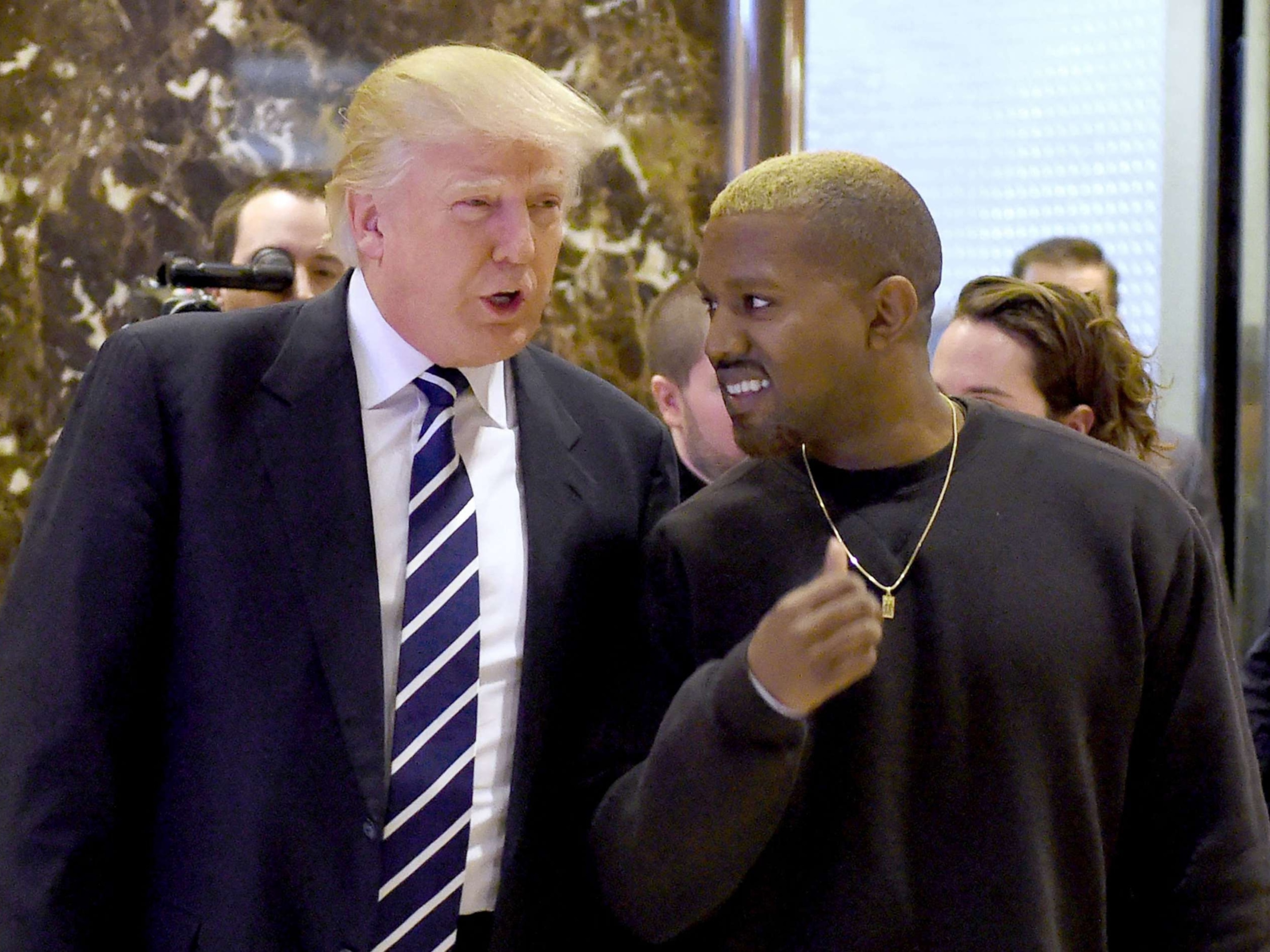 PHOTO: In this file photo taken on Dec. 13, 2016, President-elect Donald Trump and singer Kanye West arrive to speak with the press after their meetings at Trump Tower in New York. 