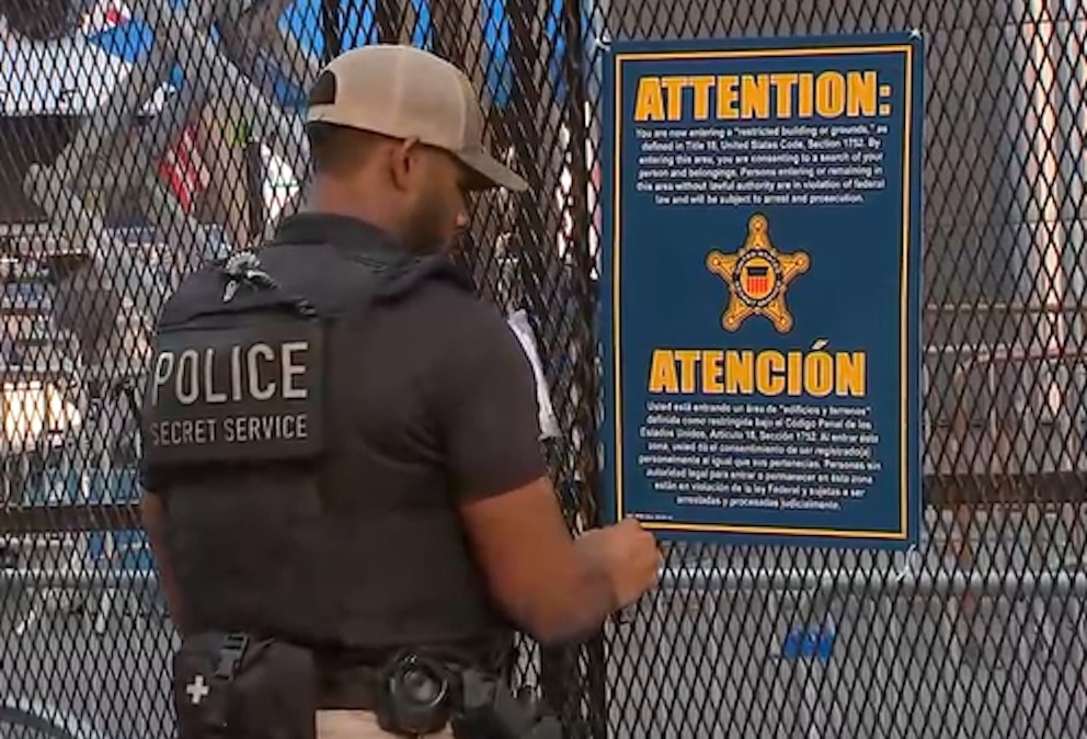 PHOTO: A U.S. Secret Service officer secures a temporary security fence erected outside Madison Square Garden, June 8, 2026, ahead of Game 3 of the NBA Finals between the Knicks and Spurs, which is expected to be attended by President Donald Trump.