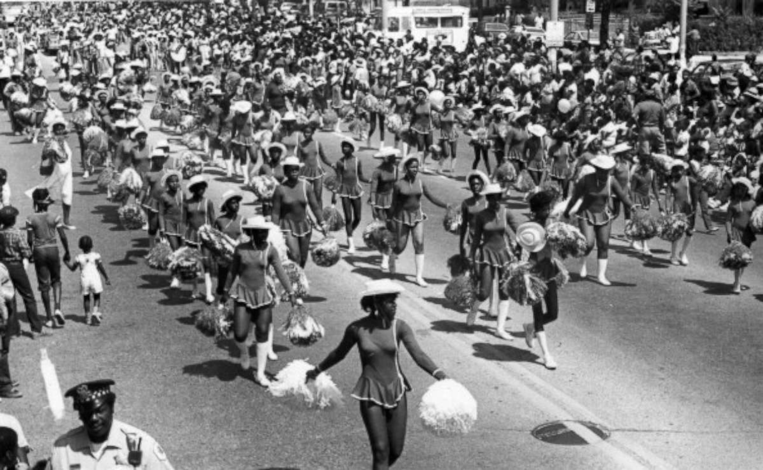 PHOTO: Cheerleaders from a local school walk the parade route during the annual Bud Billiken parade, sponsored by the Chicago Defender, in Chicago, in 1984. 