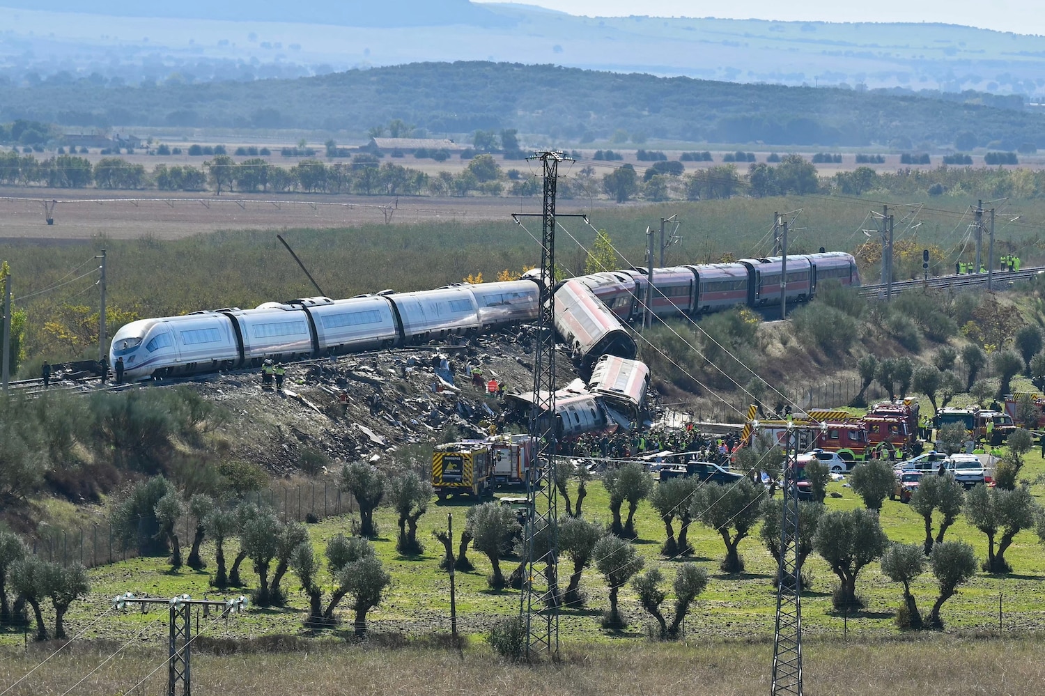 Emergency services are seen at the site of a train collision between a high speed Renfe AVE train and Iryo train around 150kms south of Madrid between Urda and Los Yebenes in the province of Toledo, October 28, 2026. Javier Soriano/AFP via Getty Images