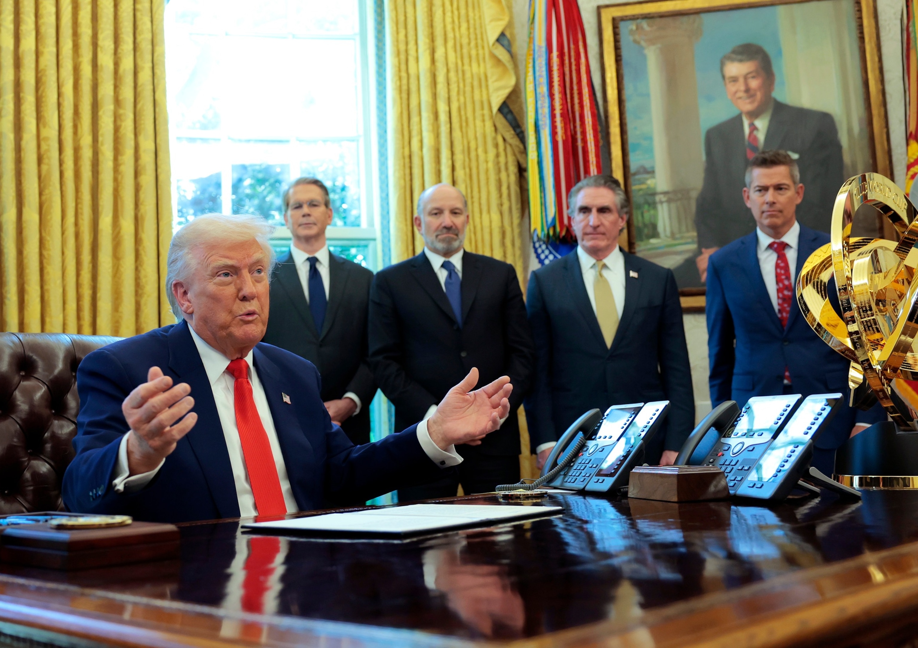 PHOTO: President Donald Trump prepares to sign executive orders in the Oval Office, April, 9, 2025 in Washington.