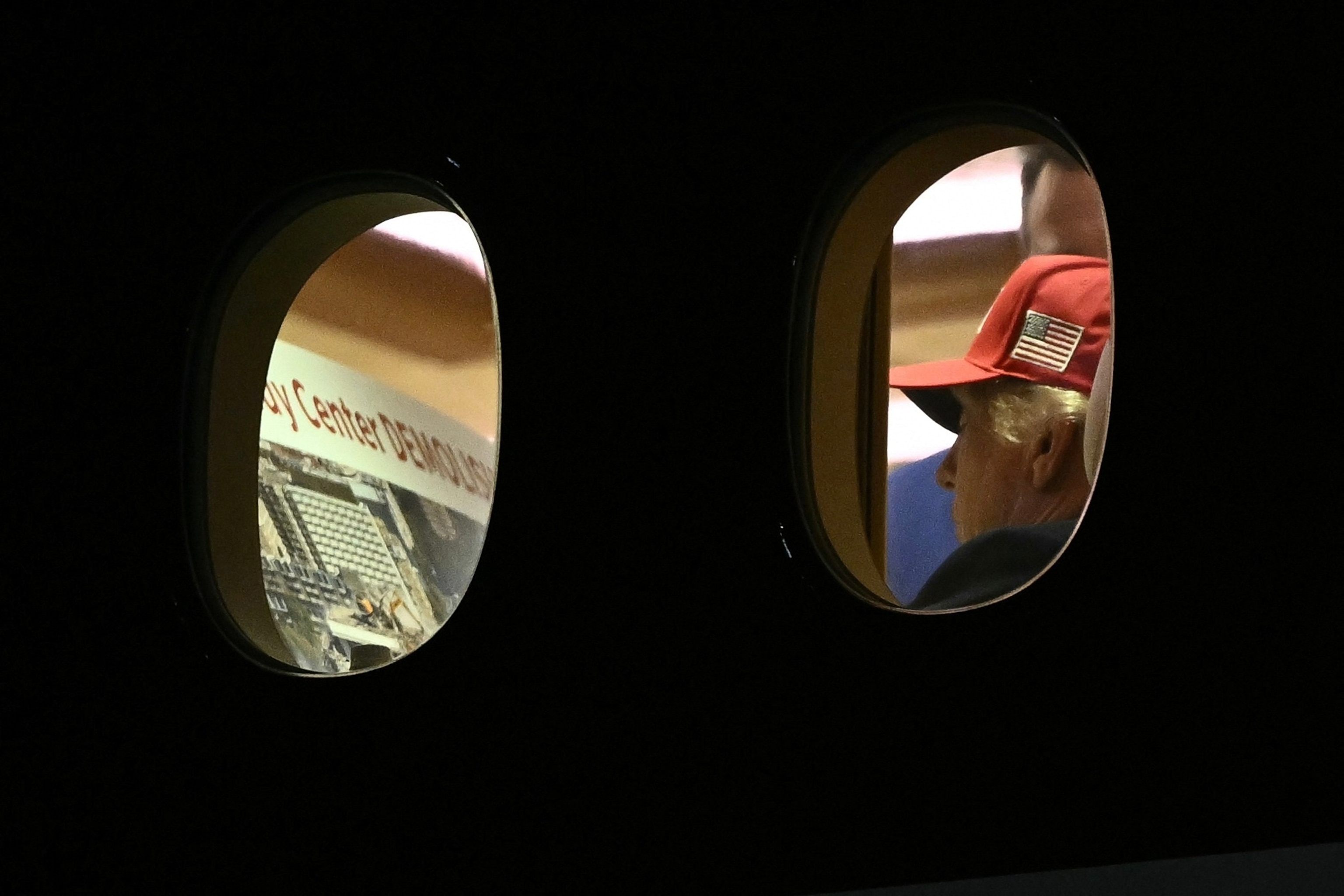 PHOTO: President Donald Trump is seen aboard Air Force One looking at a large printout of the Kennedy Center after landing at Joint Base Andrews, Maryland on September 16, 2026.