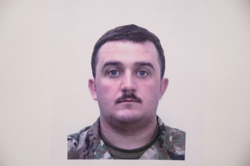 PHOTO: A picture of National Guard member Andrew Wolfe is displayed at a press conference, after Wolfe and National Guard member Sarah Beckstrom were shot, in Washington, D.C., Nov. 27, 2025.