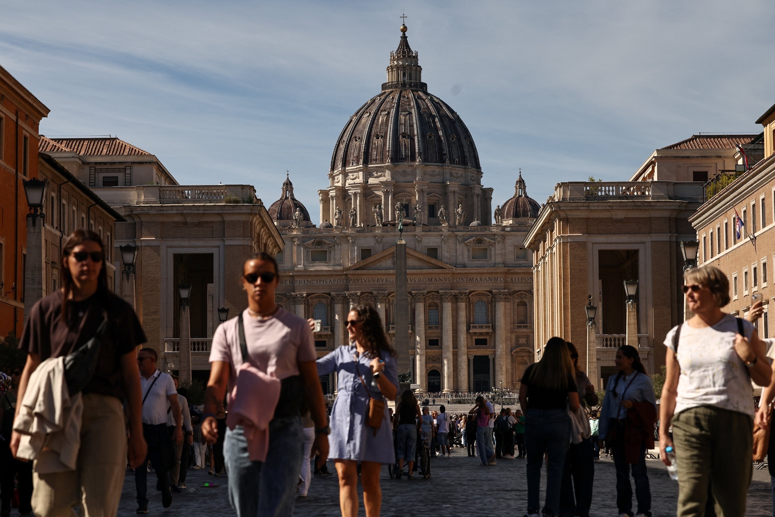 PHOTO: People walk in Via della Conciliazione, near the Vatican, with St. Peter's Basilica visible in the background, in Rome, Italy, October 11, 2026.
