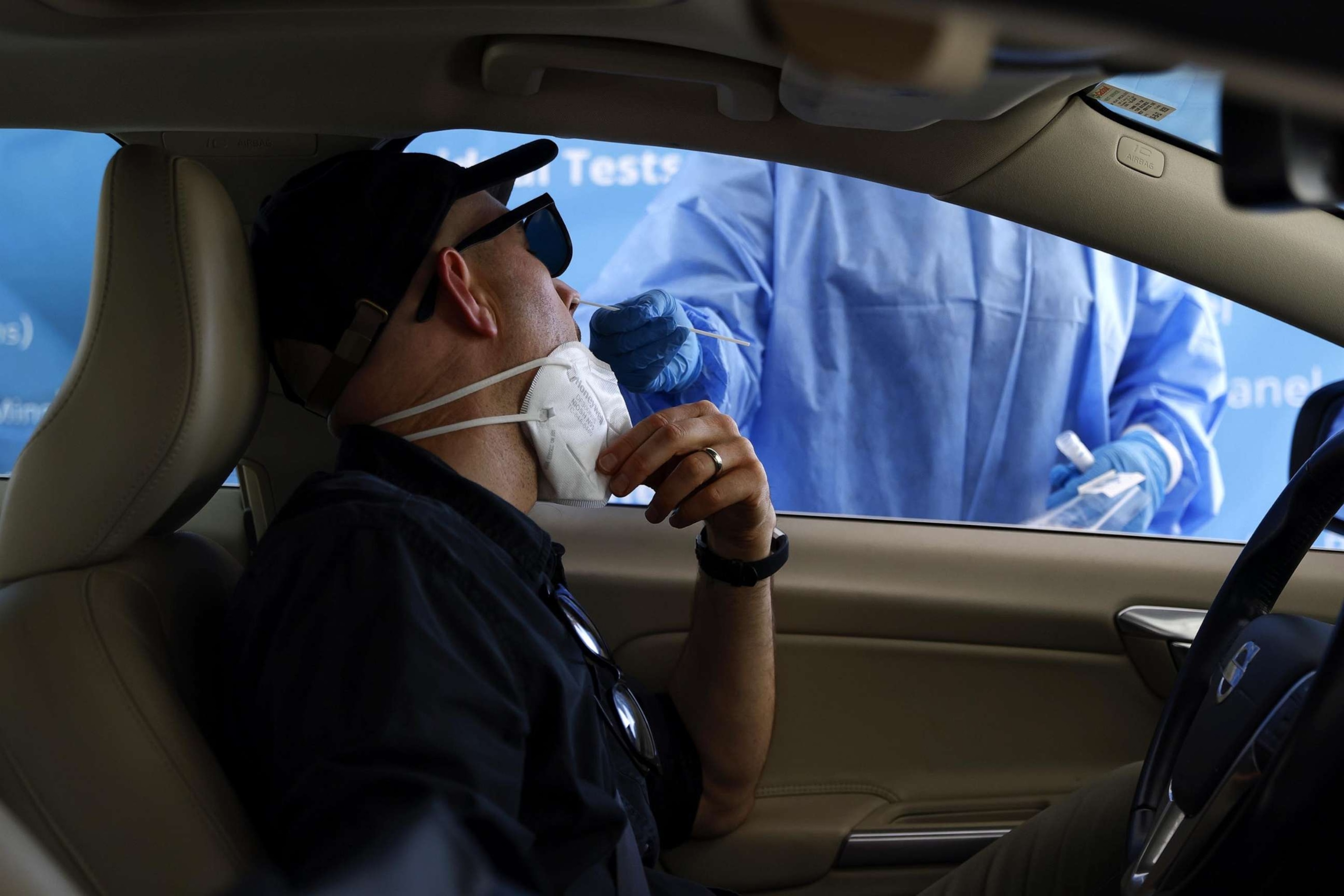 PHOTO: A healthcare worker takes a nasal swab sample to test for Covid-19 at a Total Testing Solutions Covid Testing Center in Los Angeles, Aug. 31, 2023.