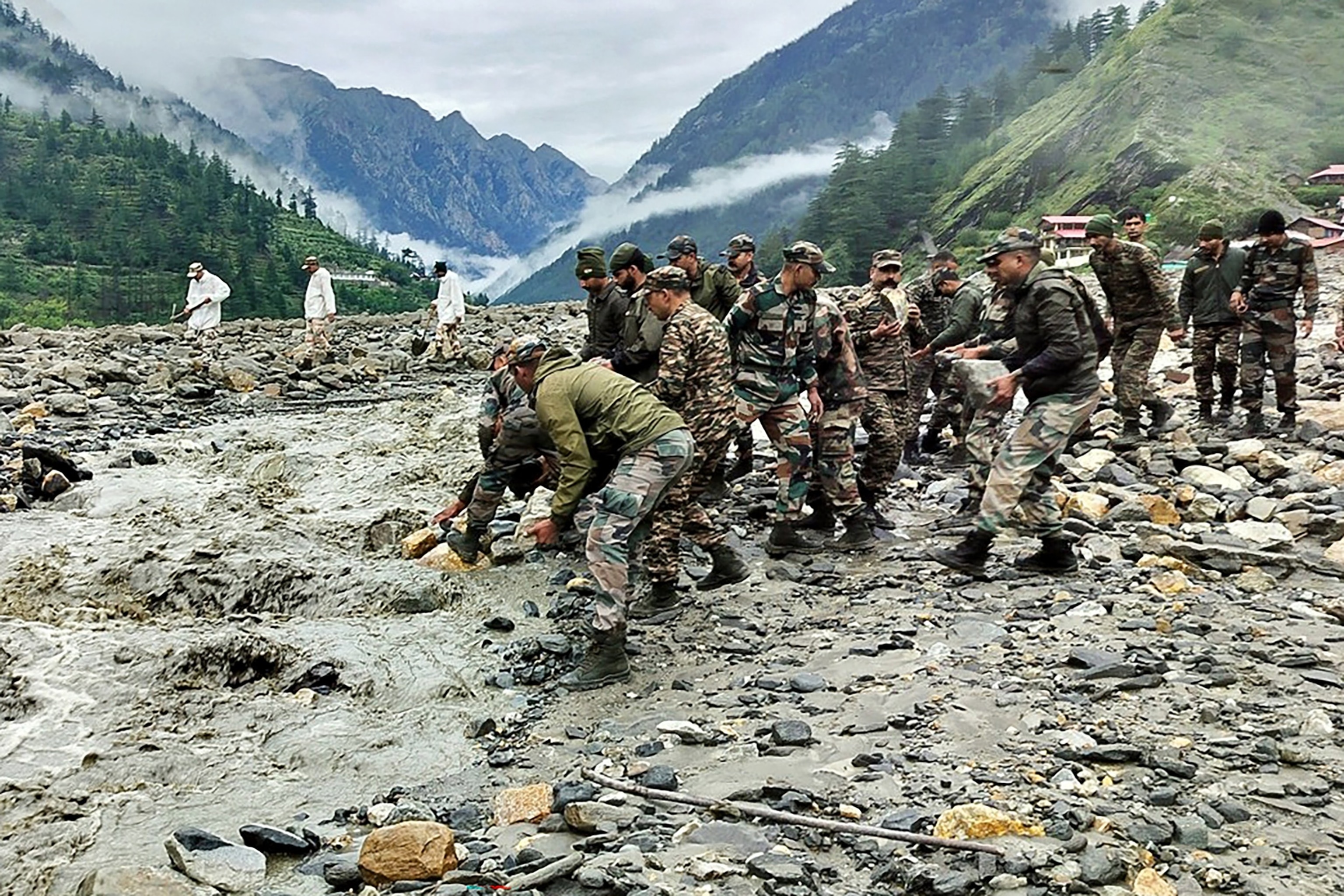 PHOTO: This handout photograph released on Aug. 6, 2025 by the Indian Army shows security and relief personnel heaving rocks and removing debris in India's Uttarakhand state.