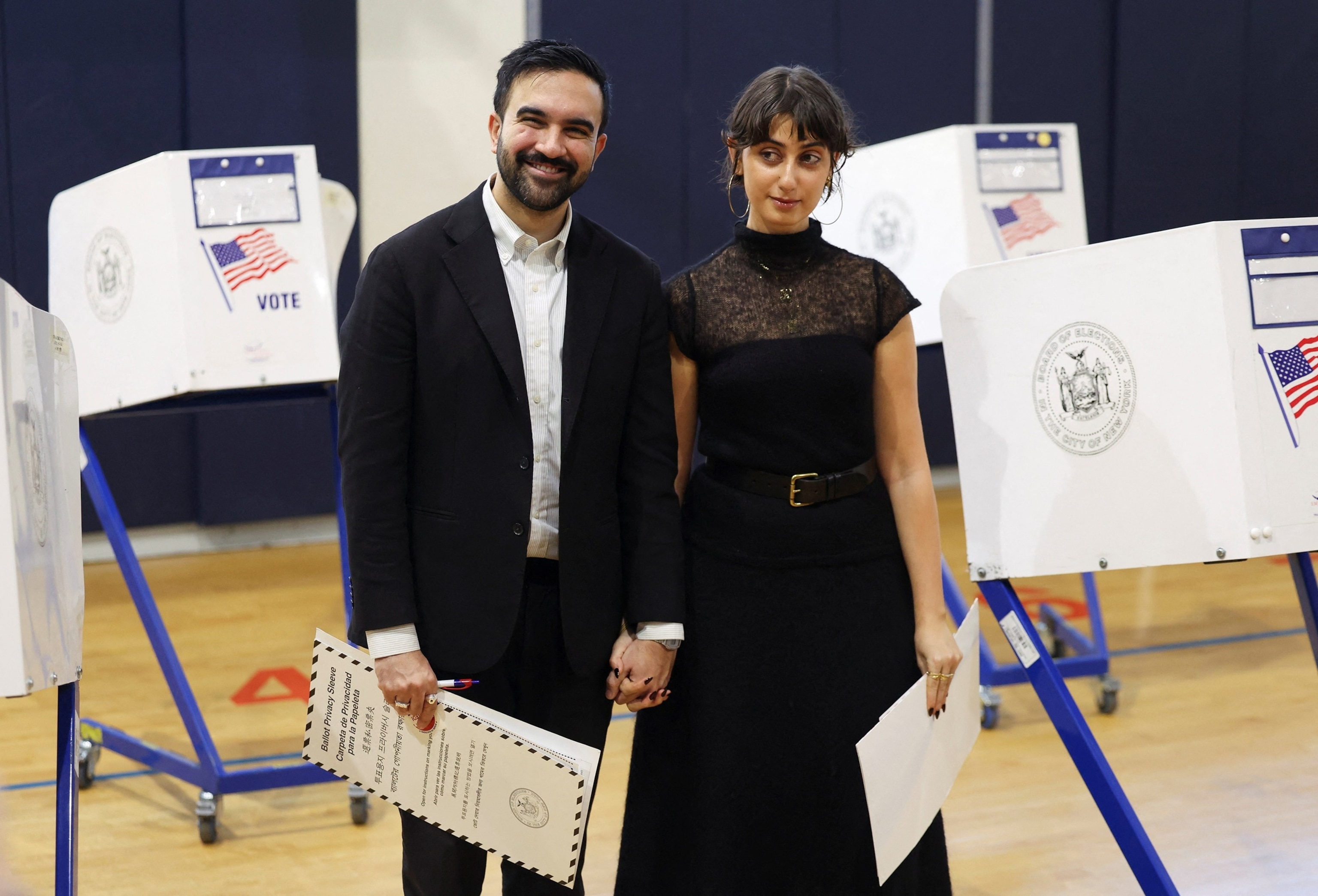 PHOTO: Democratic candidate for New York City mayor, Zohran Mamdani, and his wife, Rama Duwaji vote at a polling site at the Frank Sinatra School of the Arts High School in Astoria, Queens in New York City, November 4, 2025. 