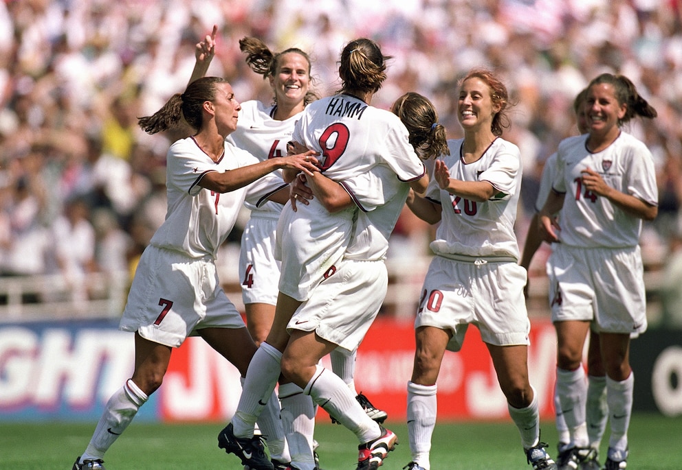 PHOTO: In this July 10, 1999, file photo, Mia Hamm #9 of Team USA is embraced by Shannon MacMillan #8 as teammates celebrate the victory over Team China in the Final match of the FIFA Women's World Cup at the Rose Bowl in Pasadena, Calif. 