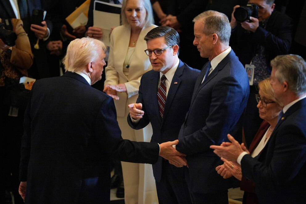 PHOTO: President Donald Trump shakes hands with House Speaker Rep. Mike Johnson and Senate Majority Leader John Thune after  the National Prayer Breakfast in Statuary Hall at the U.S. Capitol on February 06, 2025 in Washington, DC.