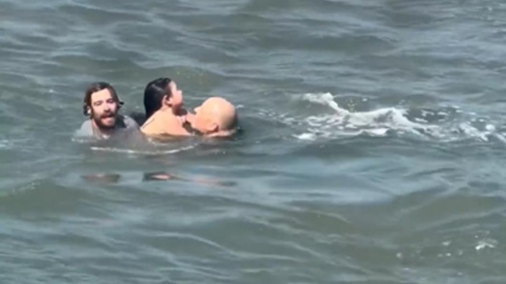 Video Surfing coach rescues dad, daughter from rip current