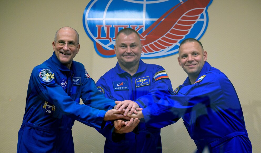 PHOTO: Expedition 72 crew members: NASA astronaut Don Pettit, left, Roscosmos cosmonauts Alexey Ovchinin, and Ivan Vagner, right, are seen in quarantine, behind glass, during a press conference, Sept. 10, 2024, in Baikonur, Kazakhstan.