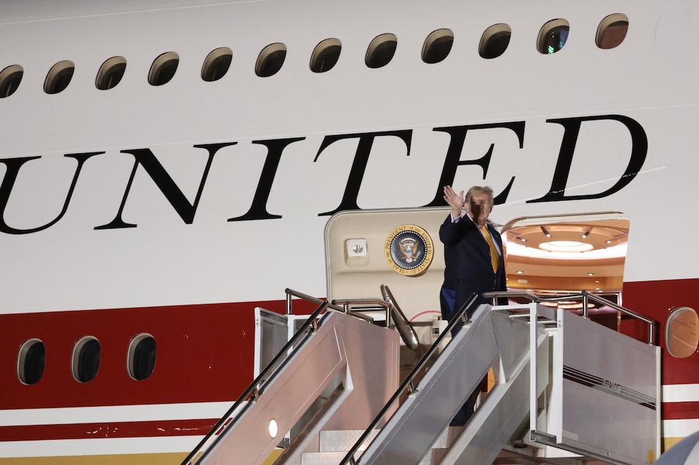 PHOTO: U.S. President Donald Trump boards the new, Qatari-gifted Air Force One after arriving on one of the older planes operating as Air Force One, to return to Washington, at RAF Mildenhall