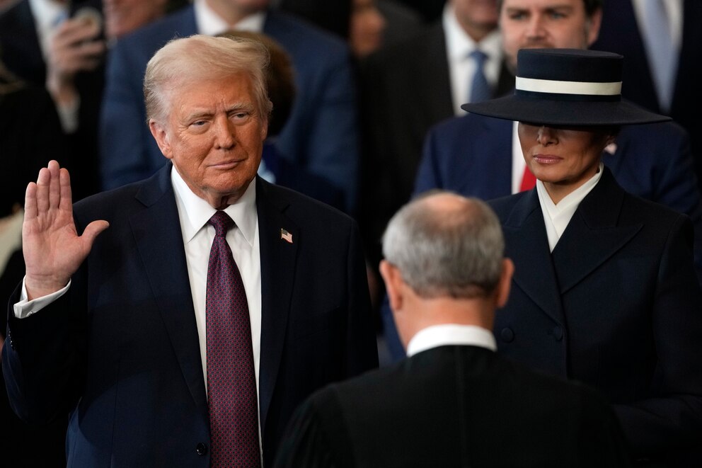 PHOTO: Donald Trump is sworn into office by Supreme Court Chief Justice John Roberts as Melania Trump holds the Bible  in the Capitol Rotunda, Jan. 20, 2025, in Washington, D.C. 