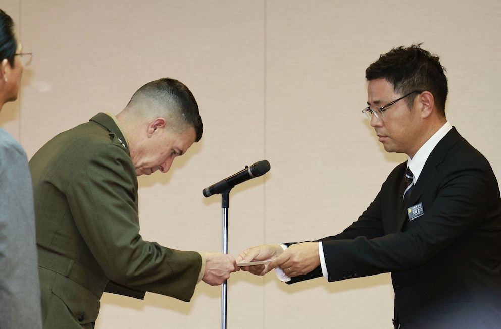 PHOTO: Okinawa Gov. Genta Koja, right, hands a letter of protest to U.S. Marine Corps Lt. Gen. Benjamin T. Watson at Okinawa prefectural office in Naha, Okinawa Monday, Oct. 5, 2026.
