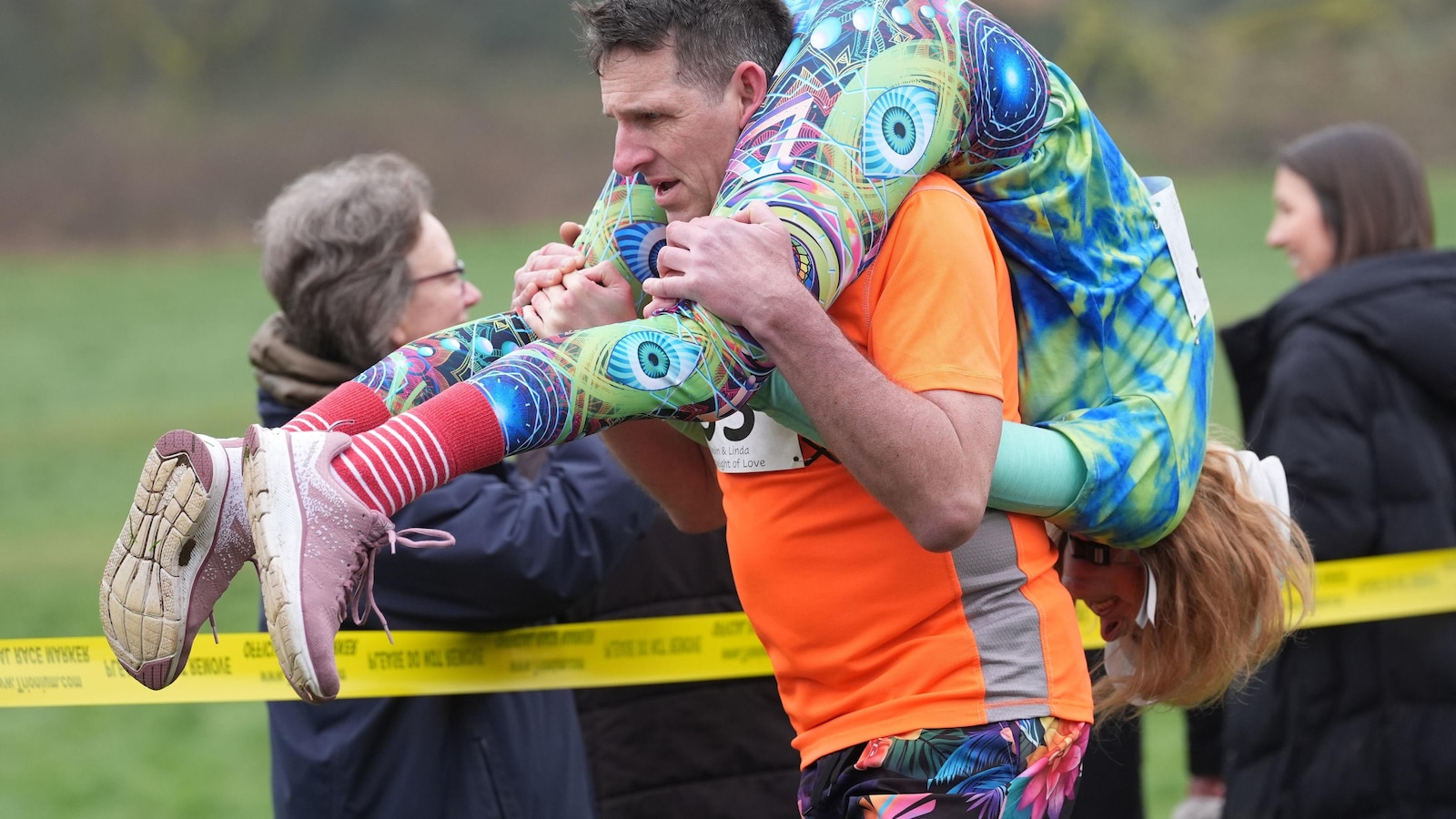 Finnish pair wins a barrel of ale in annual 'wife-carrying' contest in England
