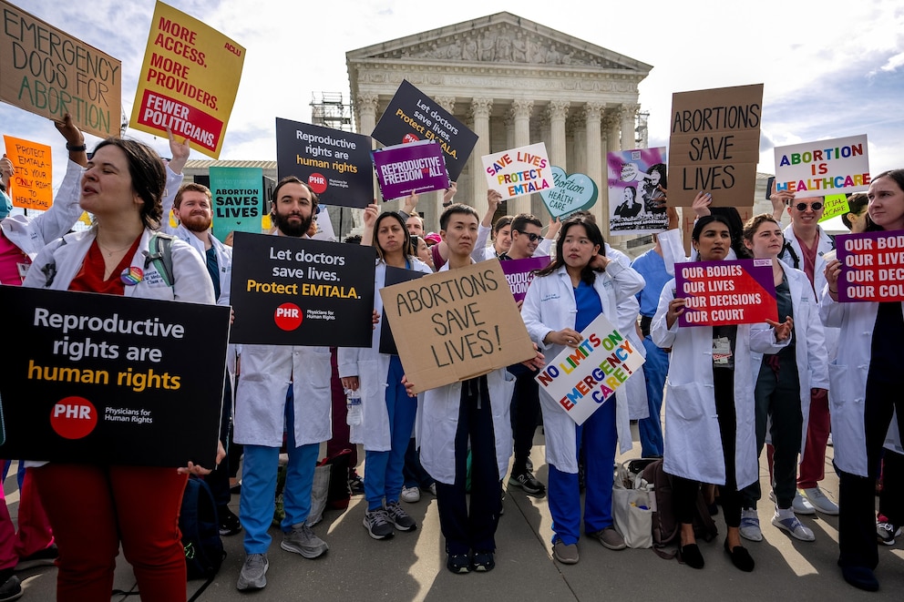 PHOTO: In this April 24, 2024, file photo, a group of doctors join abortion rights supporters at a rally outside the Supreme Court in Washington, D.C. 