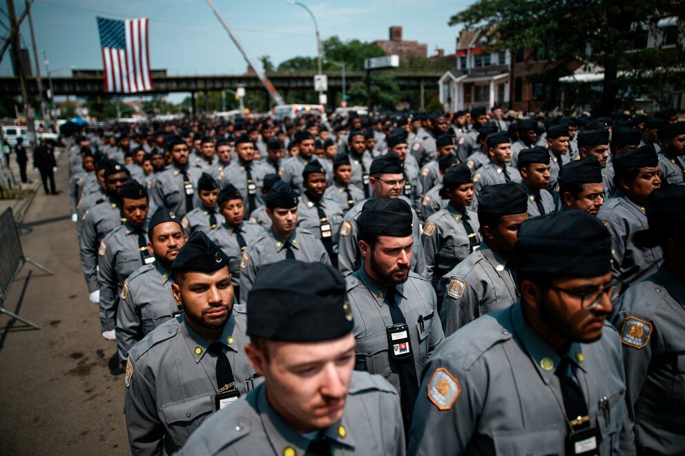 PHOTO: Police recruits stand in formation during the funeral services at the Parkchester Jame Masjid mosque for NYPD officer Didarul Islam, killed during a mass shooting at a midtown Manhattan office tower on July 28, in the Bronx, New York, July 31, 2025