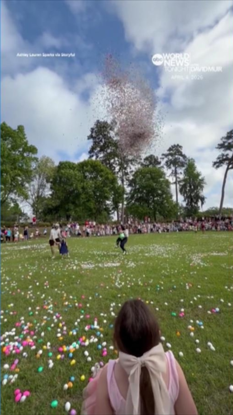Video Woman rescues toddler moments before hundreds of Easter eggs drop
