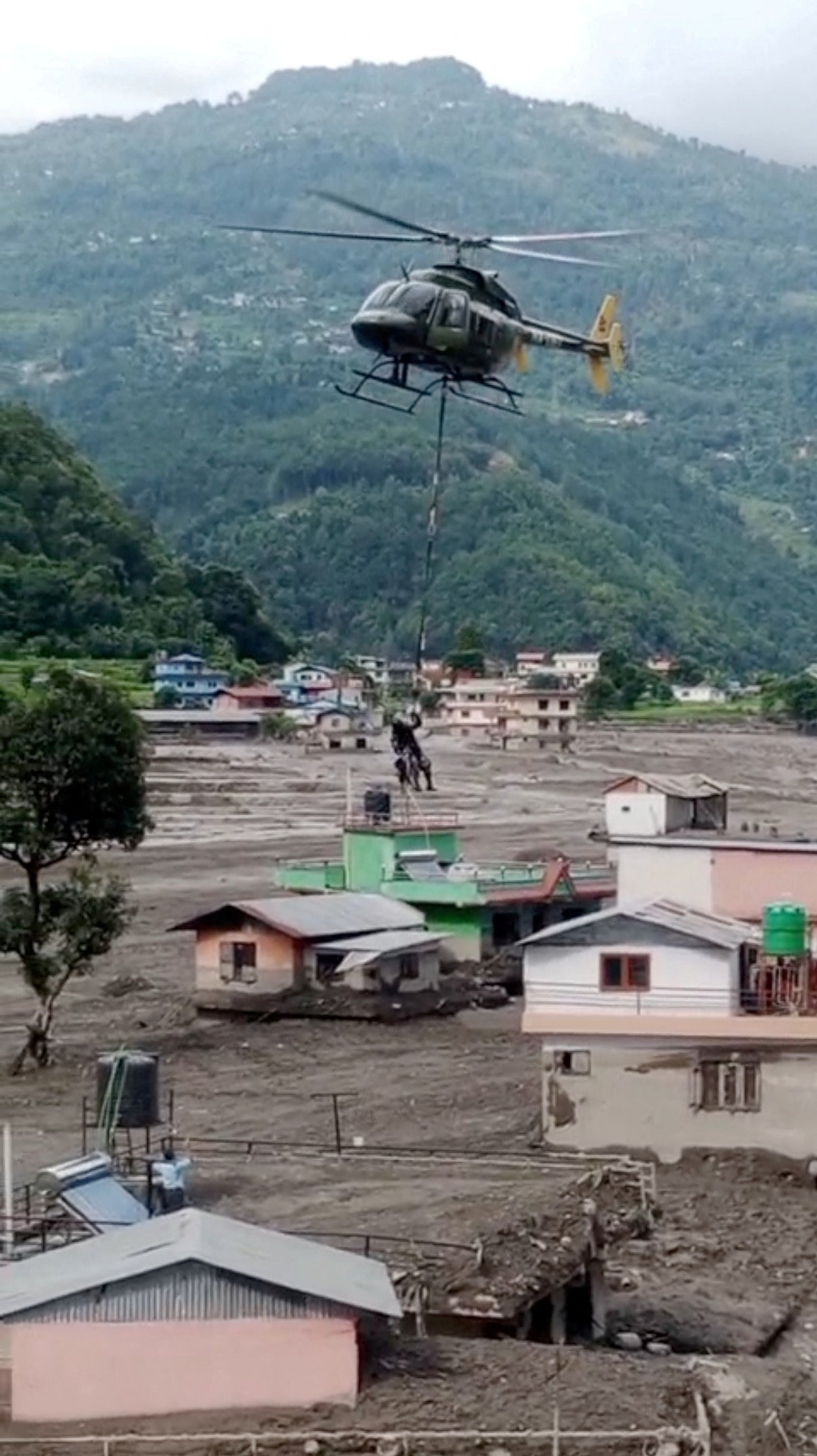 PHOTO: Nepal Army rescue stranded people at an undisclosed location, following flash floods and a mudslide