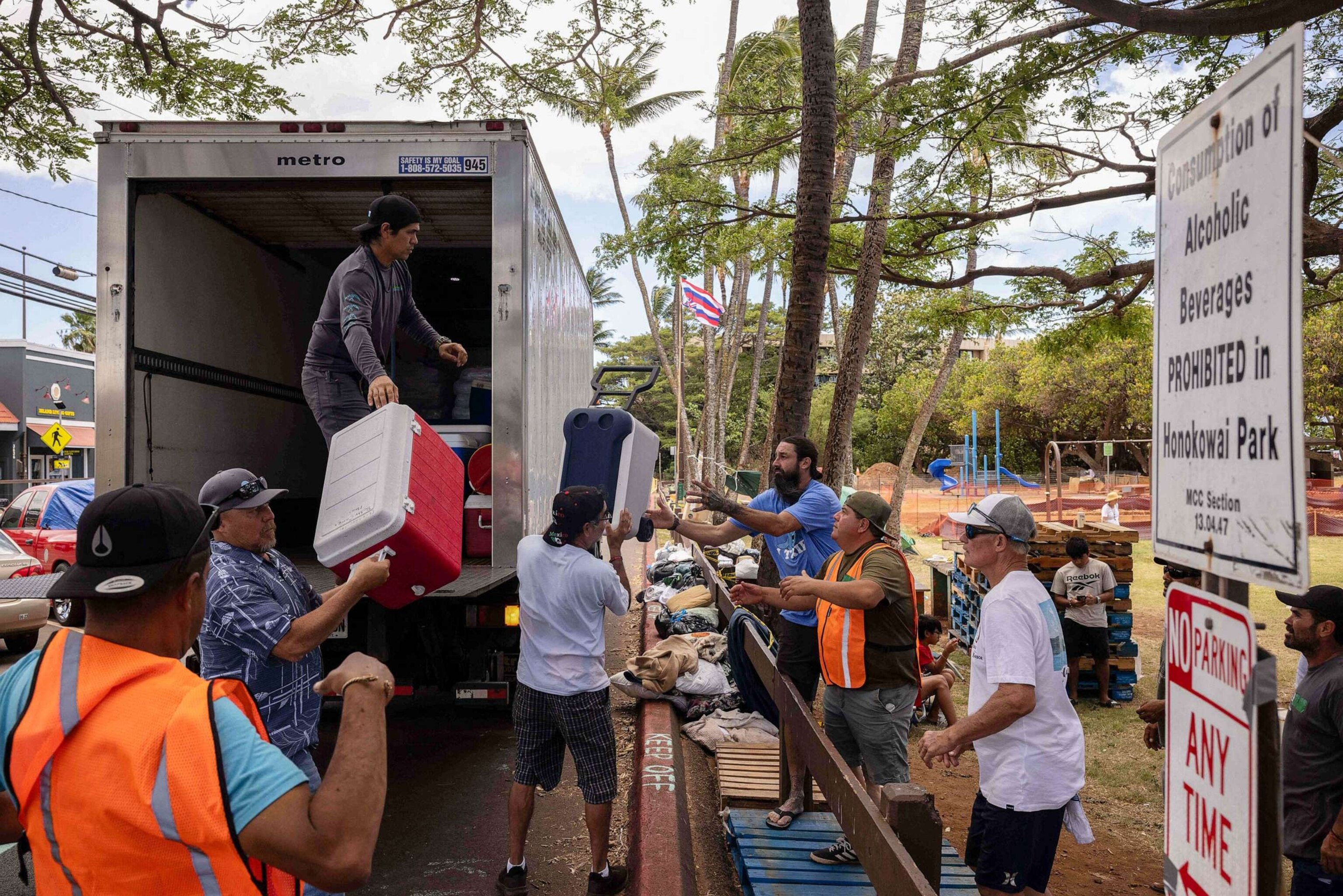 PHOTO: Volunteers unload ice and cooler donations at a distribution center for those affected by the Maui fires at Honokawai Beach Park in Napili-Honokowai, west of Maui, Hawaii, Aug. 14, 2023.