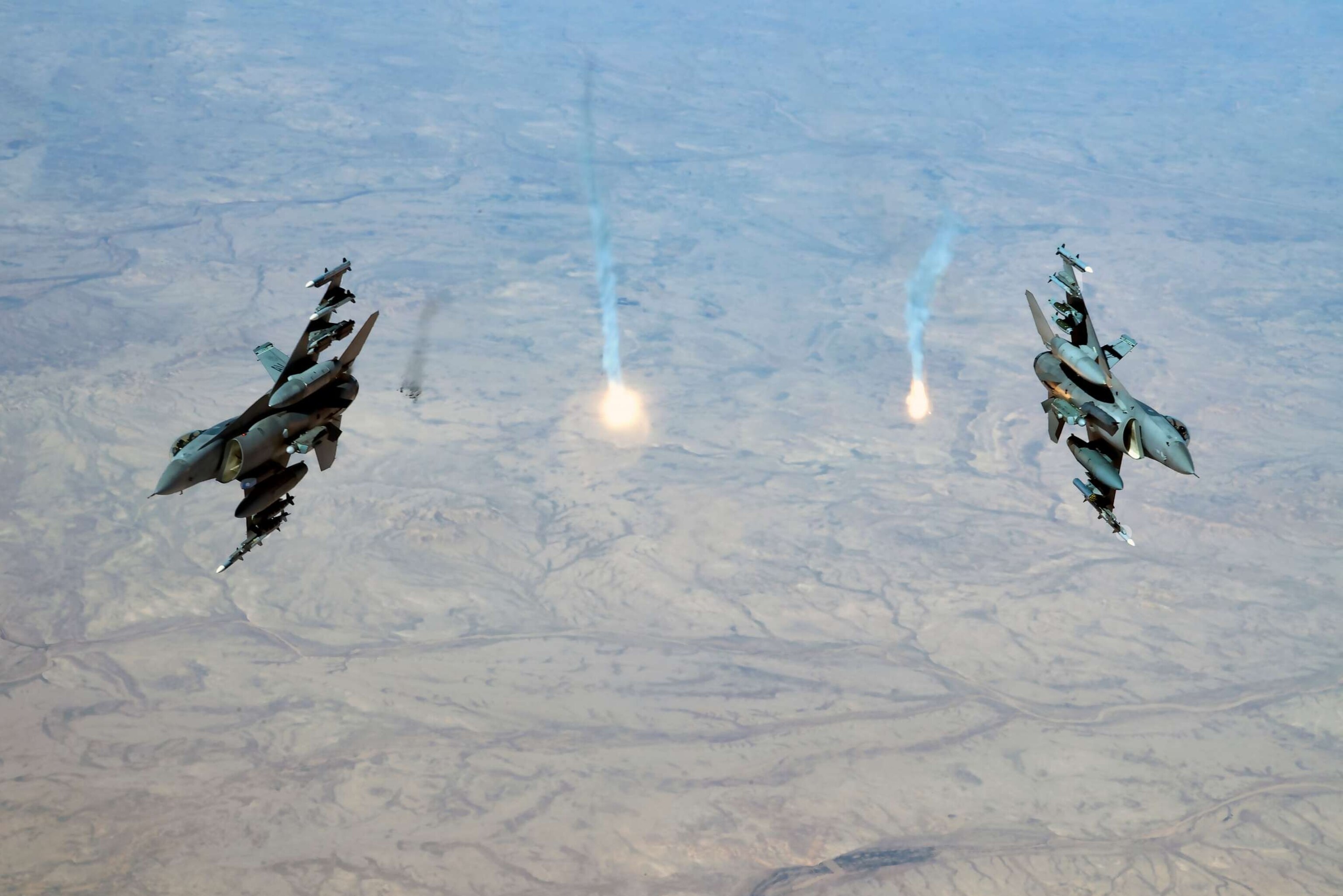 PHOTO: Two U.S. Air Force F-16 Fighting Falcons assigned to the 555th Expeditionary Fighter Squadron, release flares over Iraq, Feb. 6, 2020.