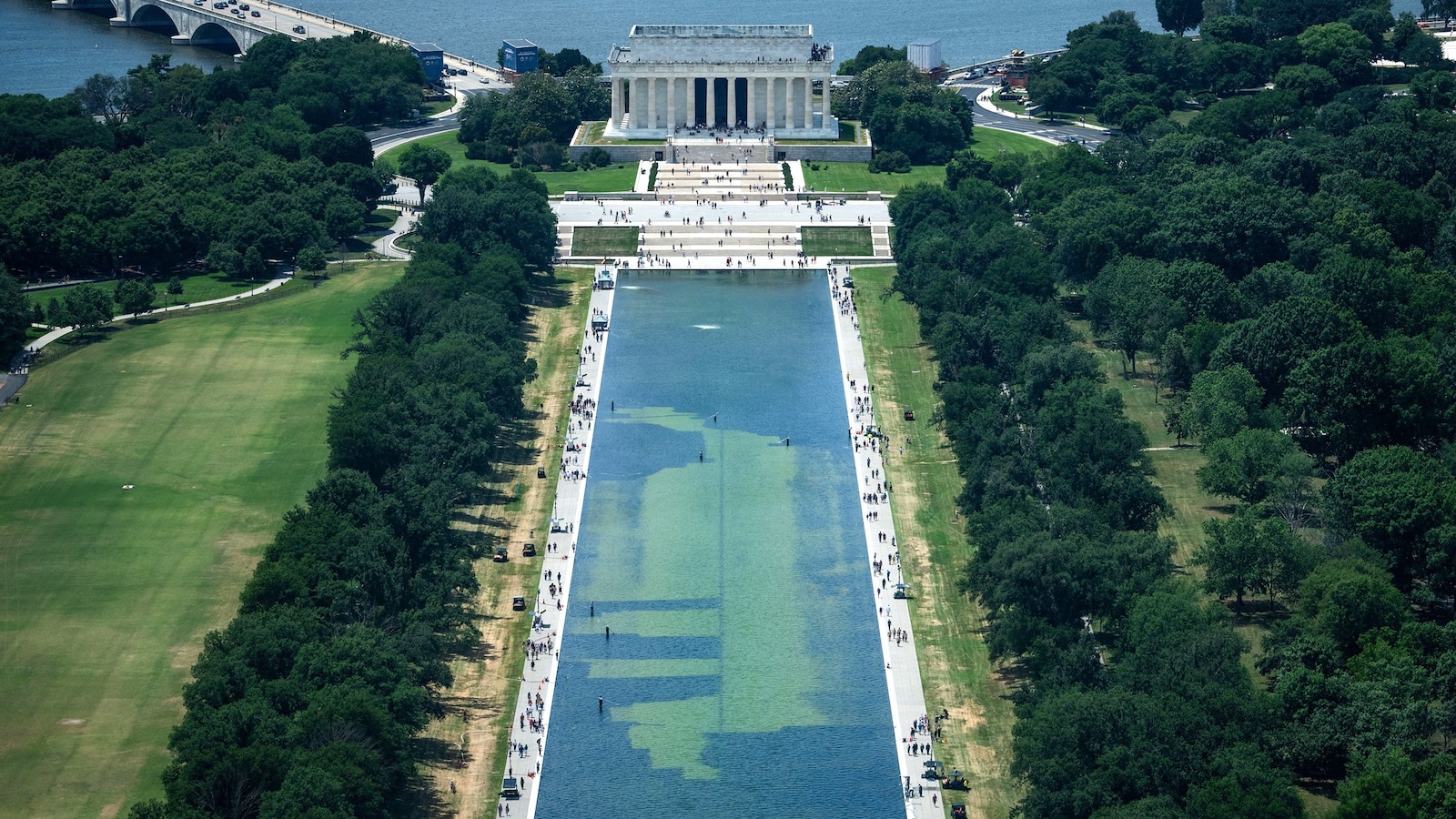 Murky Reflecting Pool draws tourists, but not for reasons Trump wanted
