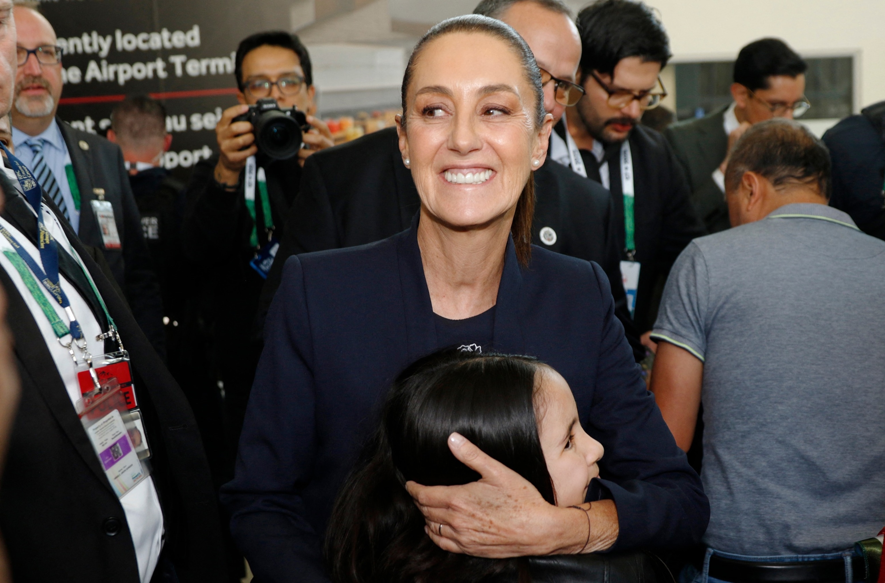 PHOTO: Mexican President Claudia Sheinbaum hugs young fan Cayla Espino as she is greeted by supporters upon arriving at Calgary International Airport in Alberta, Canada, June 16, 2025, to attend the Group of Seven Summit. 