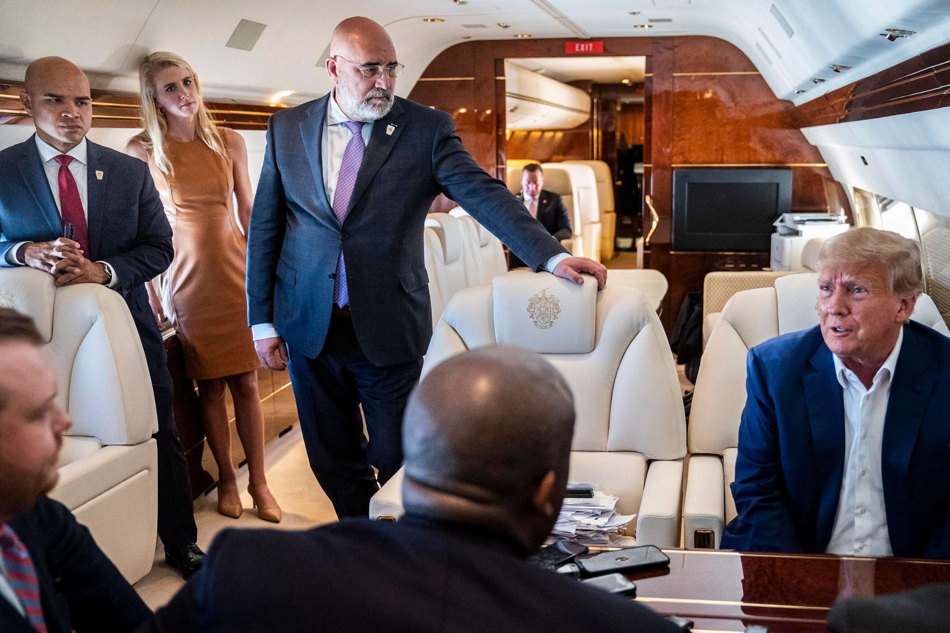 PHOTO: In this March 13, 2023, file photo, Walt Nauta, aid to former President Donald Trump, listens as former President Trump speaks with reporters and staff on his airplane, as he is flown to Iowa from West Palm Beach, Fla.