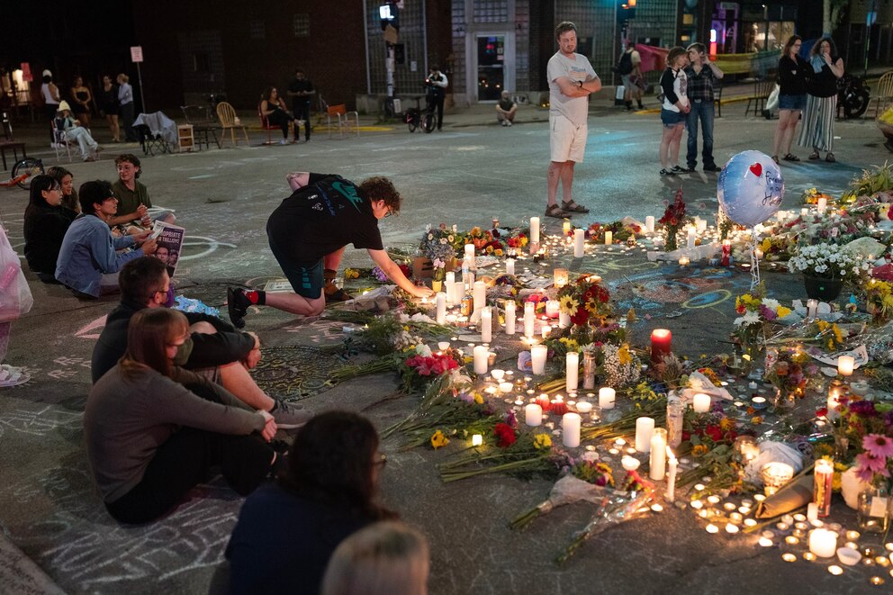 PHOTO: People light candles at a memorial at the intersection where Corey Ruiz was shot and killed yesterday by a Madison Police officer on July 23, 2026, in Madison, Wisconsin.