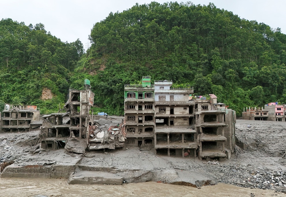 PHOTO: A drone view shows mud covering properties following a flash flood in Trishuli
