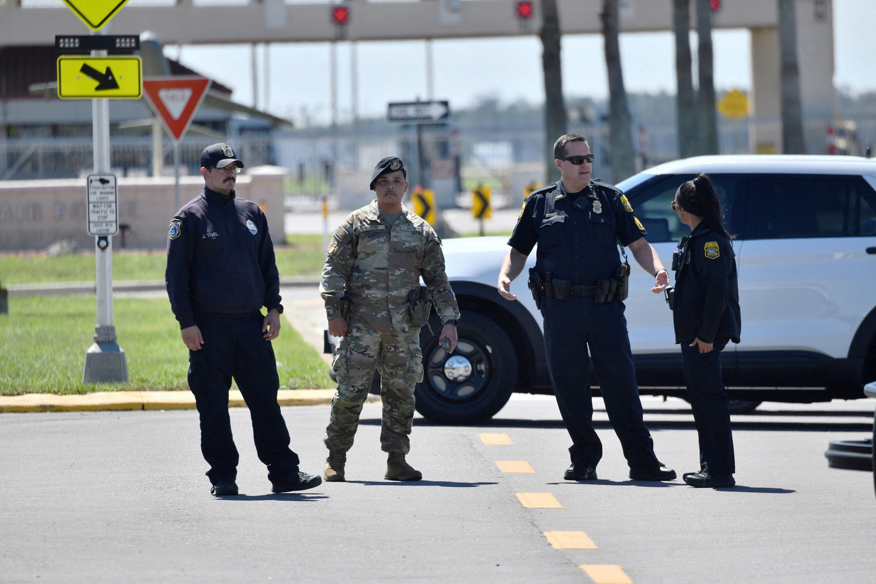 PHOTO: Tampa Police officers and U.S. Air Force service members block traffic along South Dale Mabry Highway after a security threat prompted authorities to order personnel to shelter in place at MacDill Air Force Base in Tampa, Fla., March 18, 2026.  