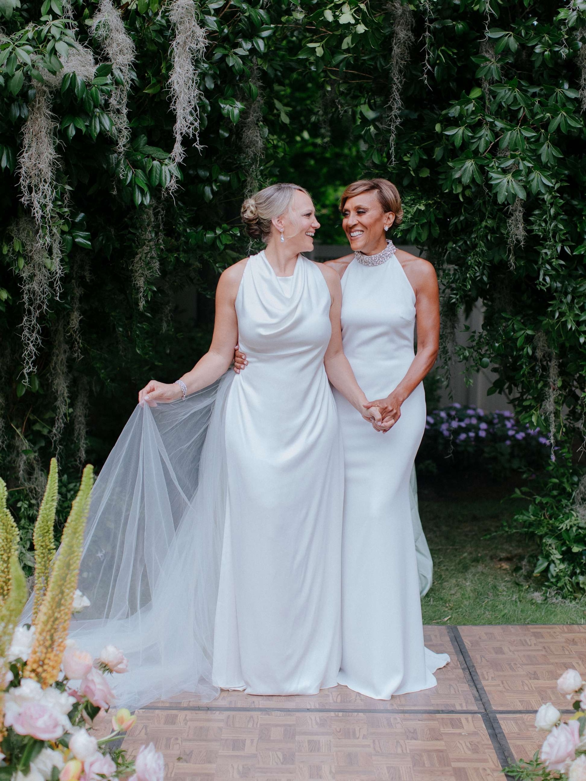 PHOTO: Robin Roberts and Amber Laign each wore wedding gowns custom-made by designers Mark Badgley and James Mischka.