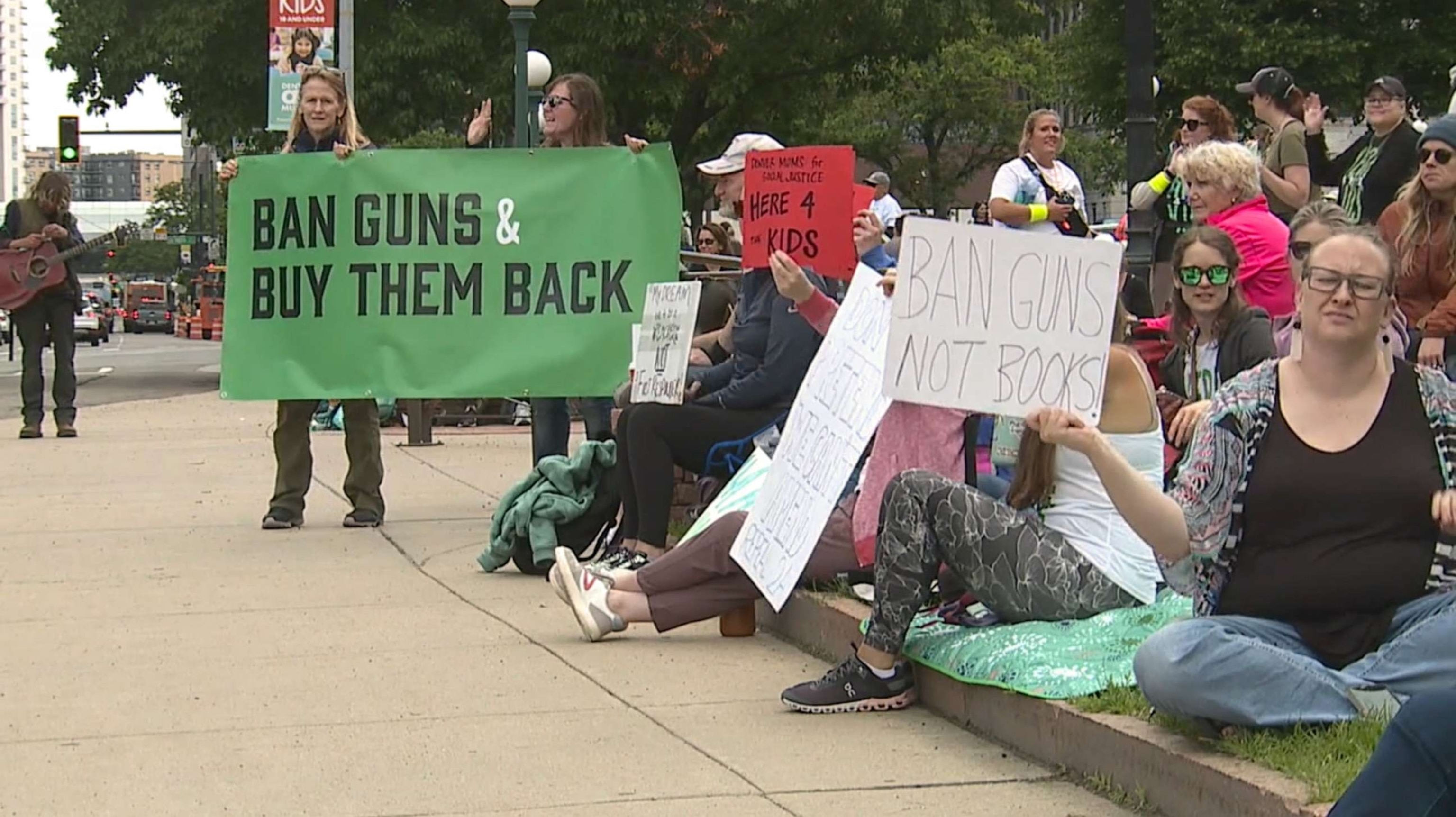 PHOTO: Demonstrators do a sit-in at Colorado state Capitol calling on Gov. Jared Polis to sign an executive order to ban guns and implement a system to buy them back, Denver, June 5, 2023.