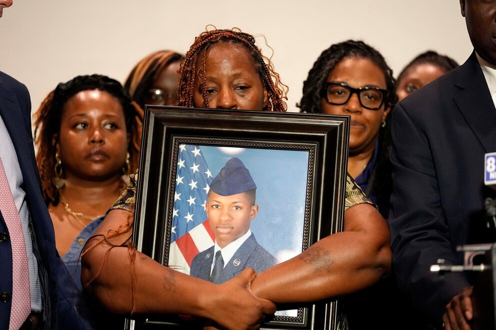 PHOTO: Chantemekki Fortson, mother of Roger Fortson, a U.S. Air Force senior airman, holds a photo of her son during a news conference with attorney Ben Crump, May 9, 2024, in Fort Walton Beach, Fla.