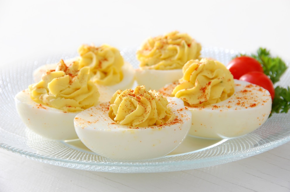 PHOTO: Deviled eggs served on clear plate with grape tomatoes