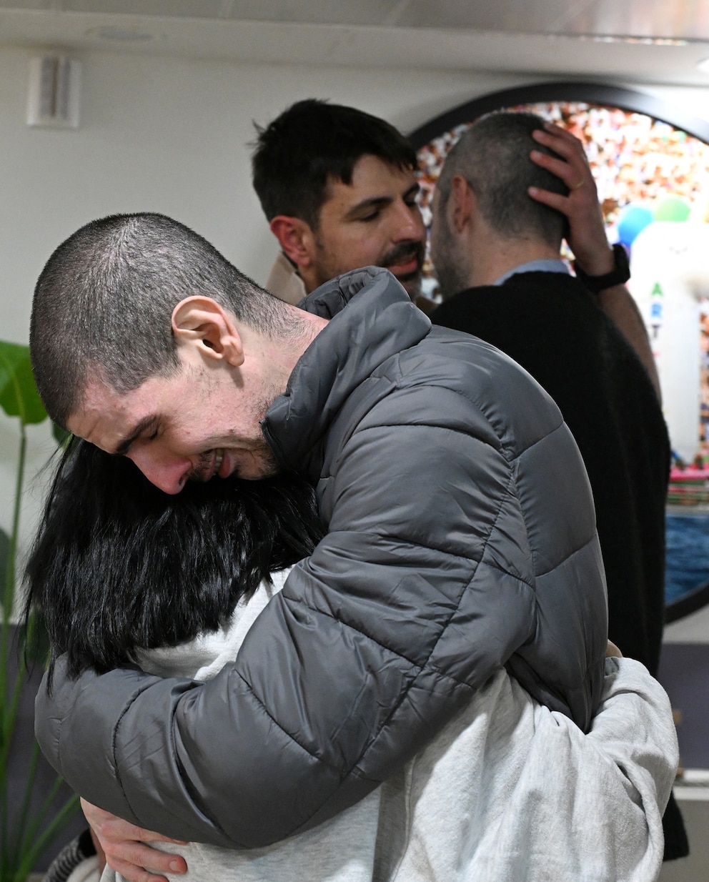 PHOTO: Released hostage Or Levy, who was seized during the deadly October 7, 2023 attack by Hamas, embraces a loved one as he is reunited with his family at Sheba Medical Center in Ramat Gan, Israel, on Feb. 8, 2025.