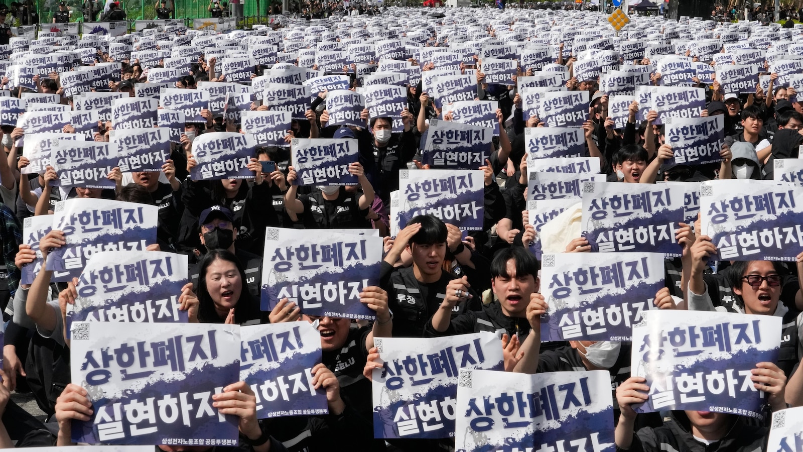 Samsung workers rally in South Korea, demanding higher pay and threatening to strike