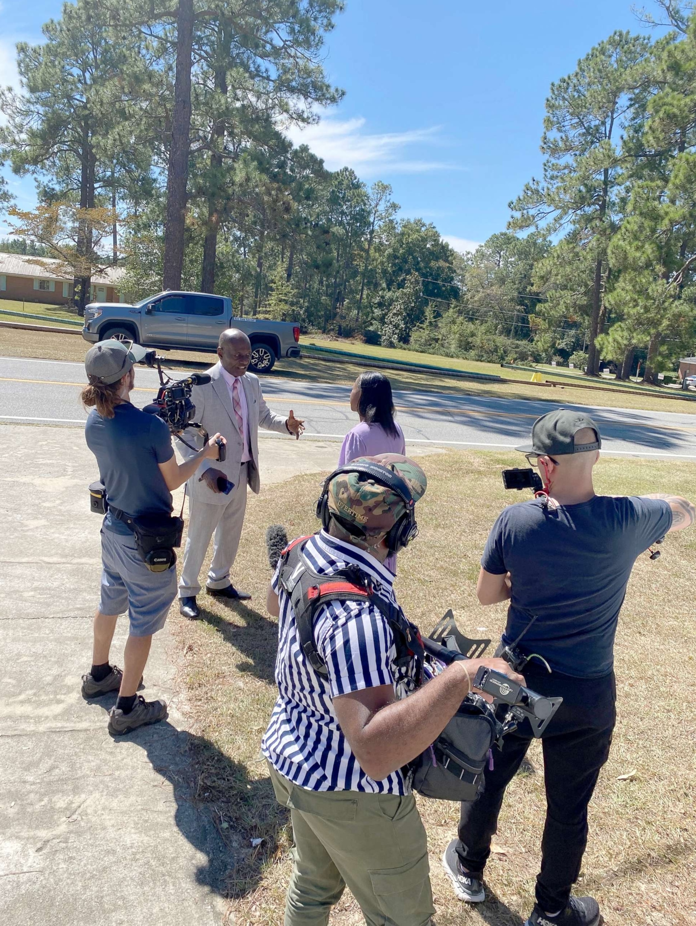 PHOTO: Lalee Ibssa, an embedded campaign reporter for ABC News, interviews a Walker supporter outside of a fundraiser in Soperton, Georgia.