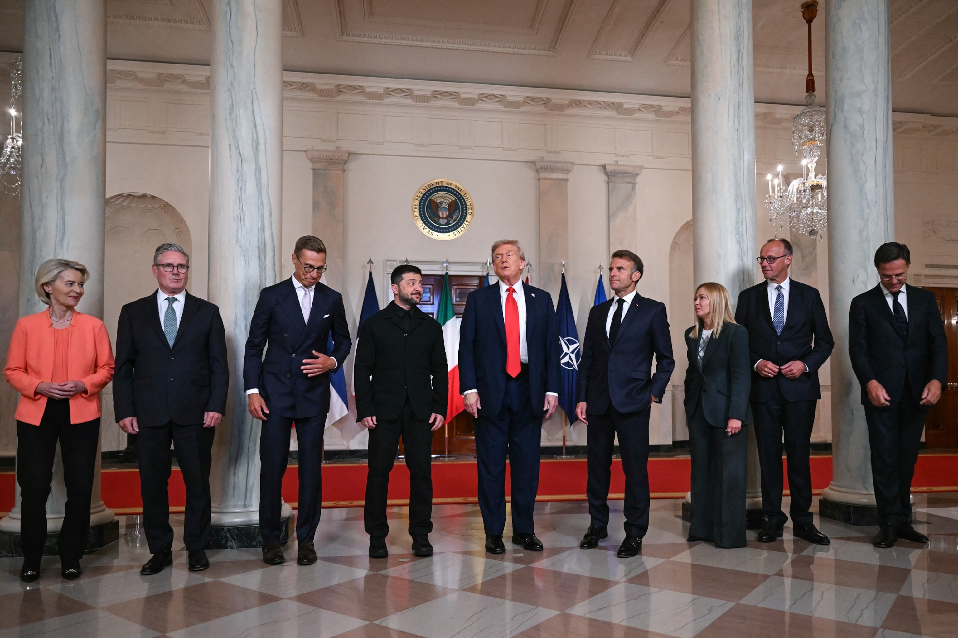 PHOTO: European leaders pose with Ukrainian President Volodymyr Zelensky and President Donald Trump  in the Cross Hall of the White House in Washington, August 18, 2025.