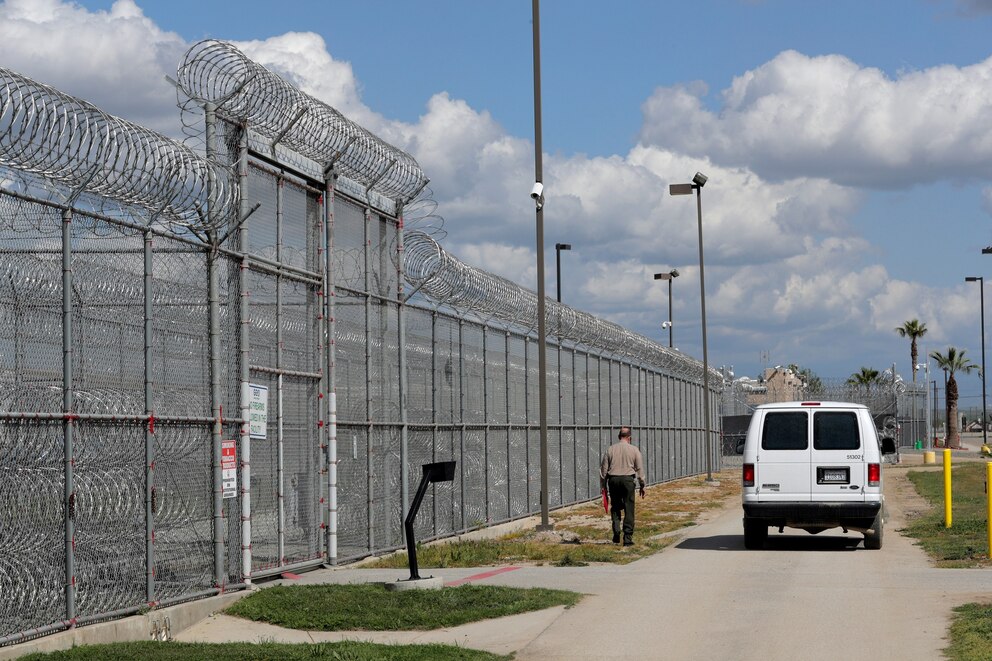 PHOTO: California Department of Corrections and Rehabilitation personnel make their way outside the Central Valley Modified Modified Community Correctional Facility in McFarland, Calif., on Thursday, March 28, 2019. 