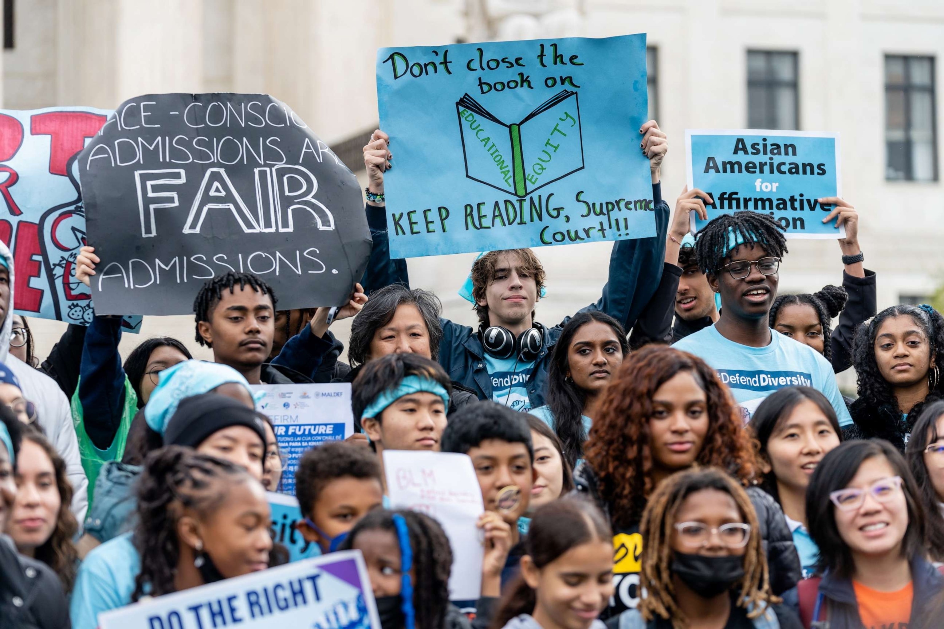 PHOTO: Supporters pose for a group photo during a rally in support affirmative action policies outside the Supreme Court in Washington, D.C., October 31, 2022.