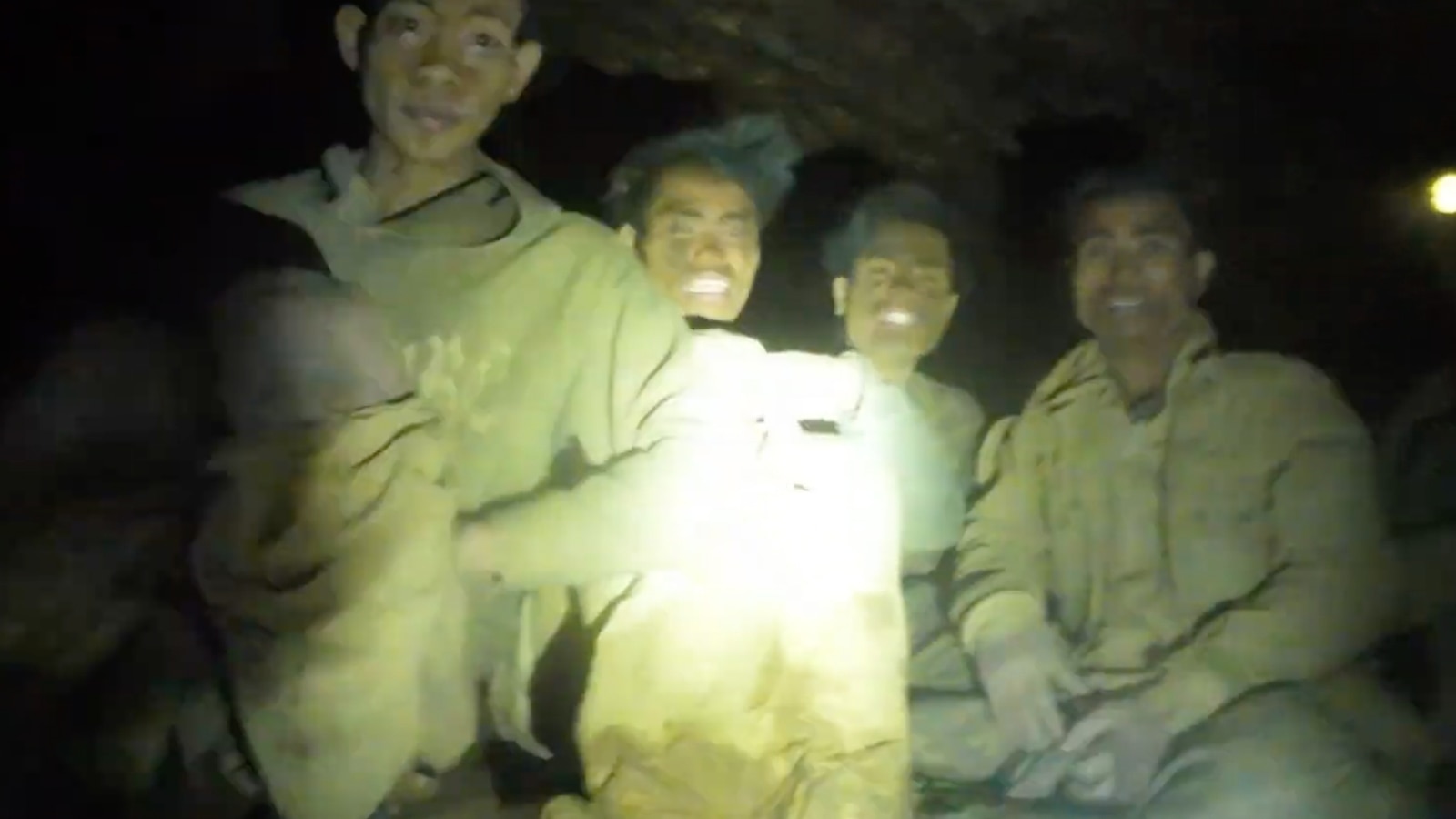 Rescuers work to drain flooded Laos cave to free 5 villagers, search for 2 missing