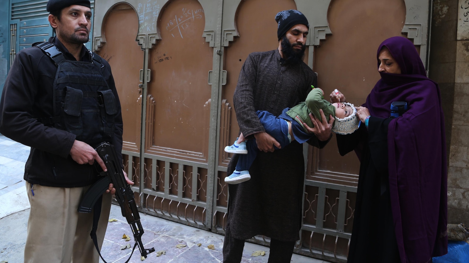 Suspected militants kill 2, including a police officer guarding polio team in northwestern Pakistan