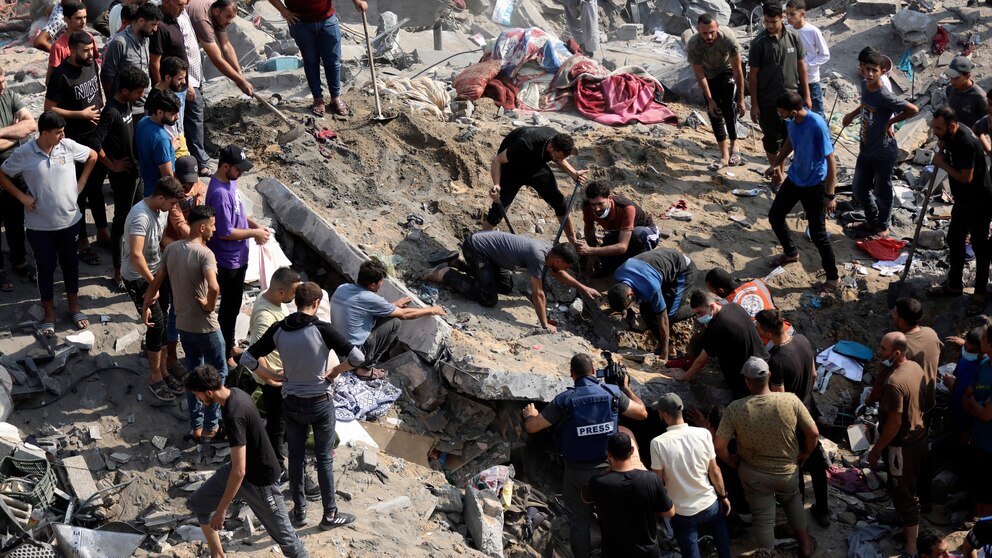 Gaza crossing opens for foreign passport holders and wounded as Israeli strikes pound refugee camp Gaza crossing opens for foreign passport holders and wounded as Israeli strikes pound refugee camp